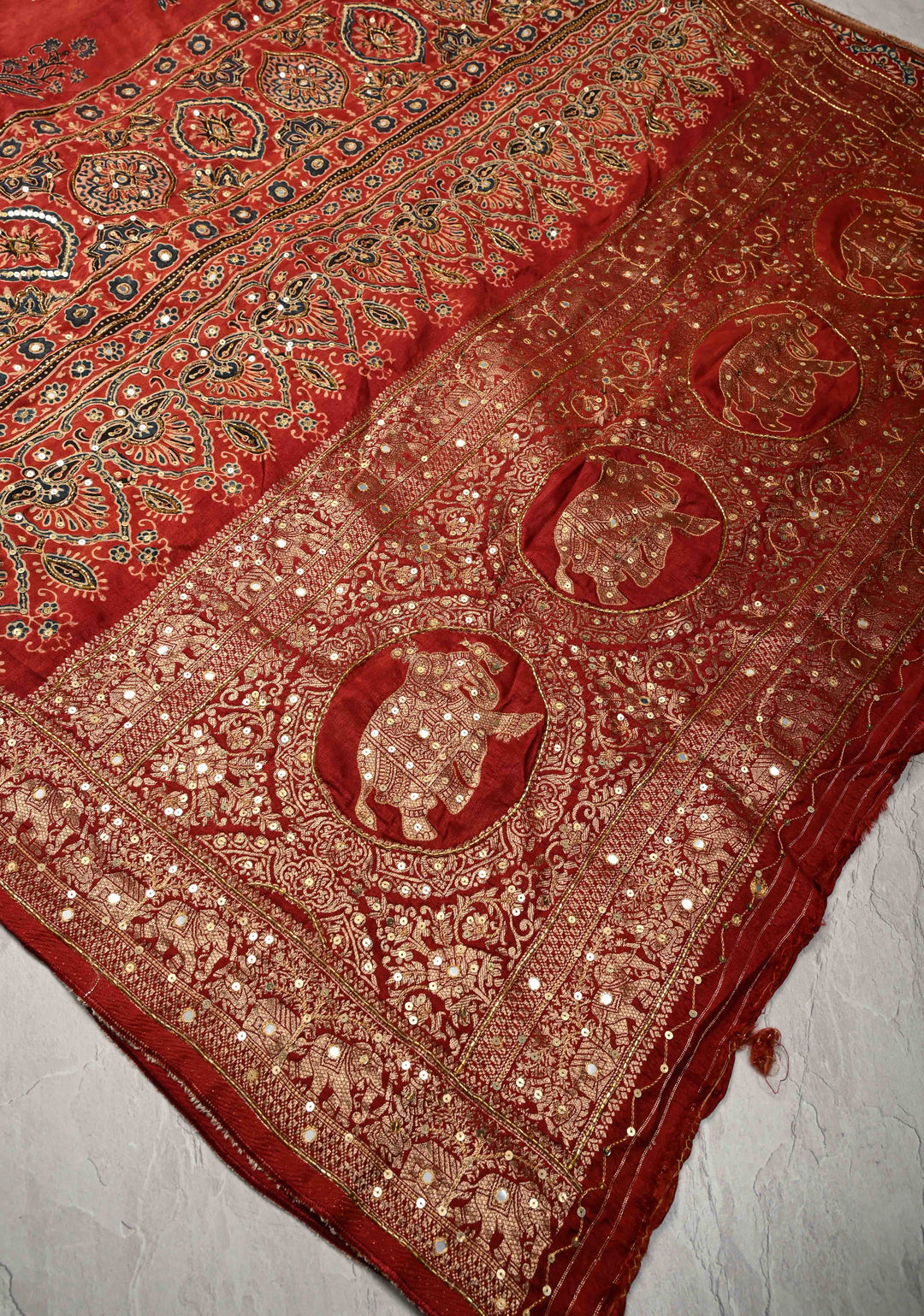 Red Ajrakh Hand Block Print on Dola Silk Saree with Cutdana-Sequins and Mirror Work Hand embroidery
