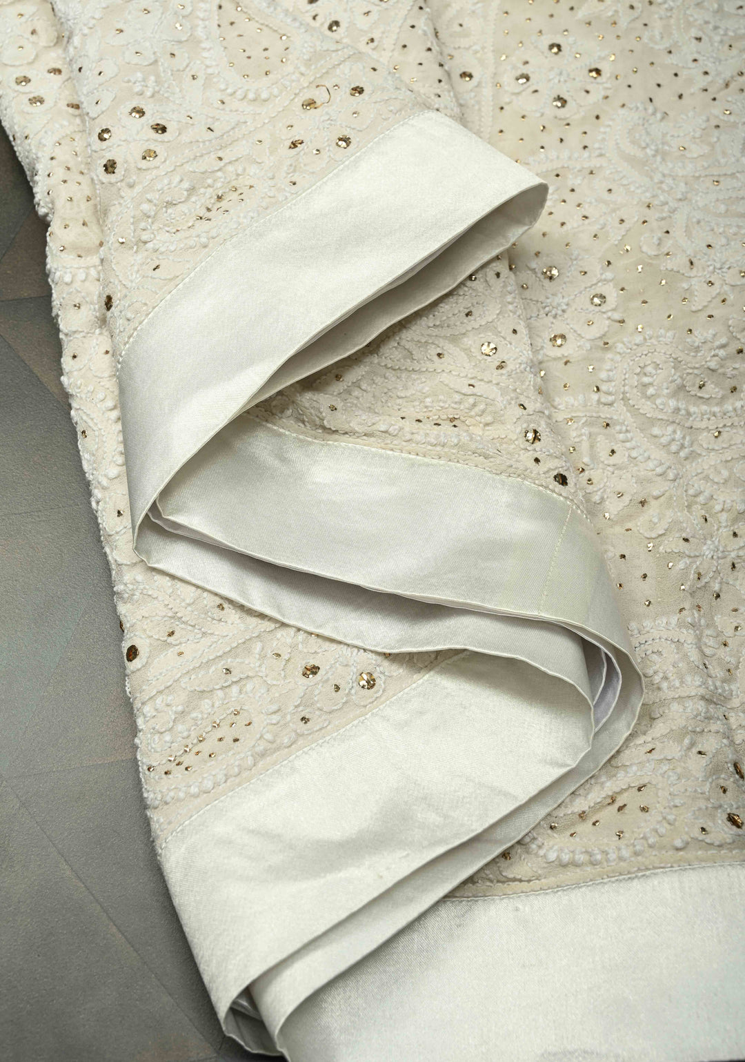 off White Hand Chikankari and Mukiesh Full Jaal Handwork on Pure Georgette Saree with Sequins,Pearls and Satin trim finish