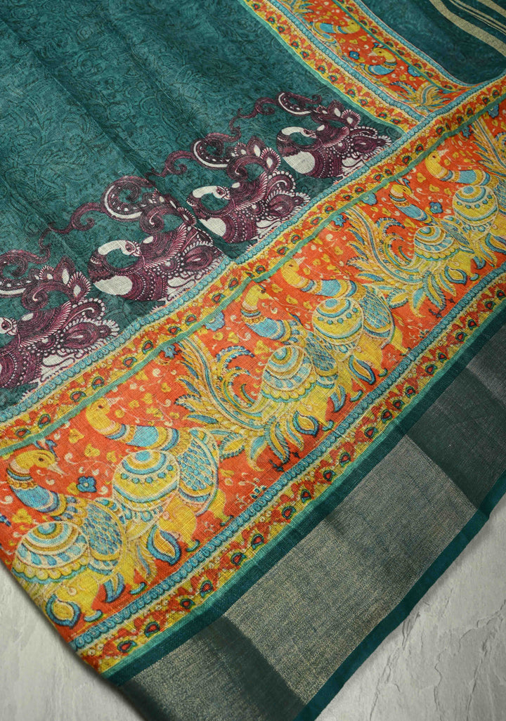 Teal Kalamkari Digital Print on Linen Saree with Peacock Motifs on Pallu and Ganga Jamuna Tissue Border