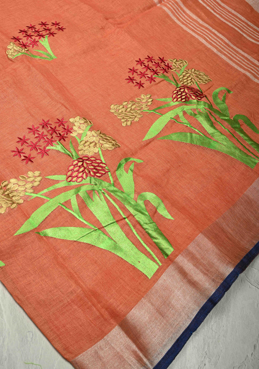 Dark Peach Linen Saree with Botanical Machine Embroidery and Tissue Zari Border