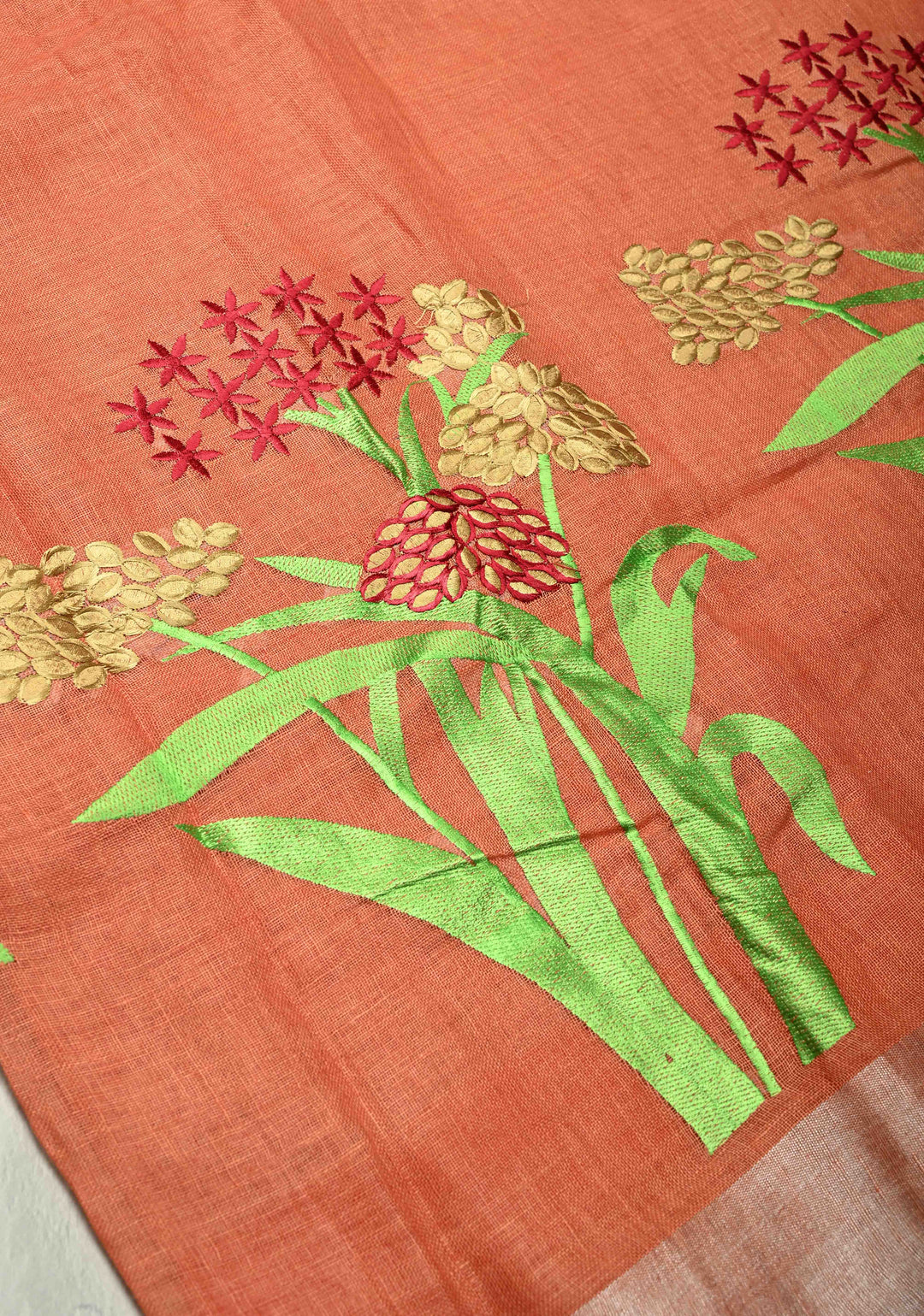 Dark Peach Linen Saree with Botanical Machine Embroidery and Tissue Zari Border
