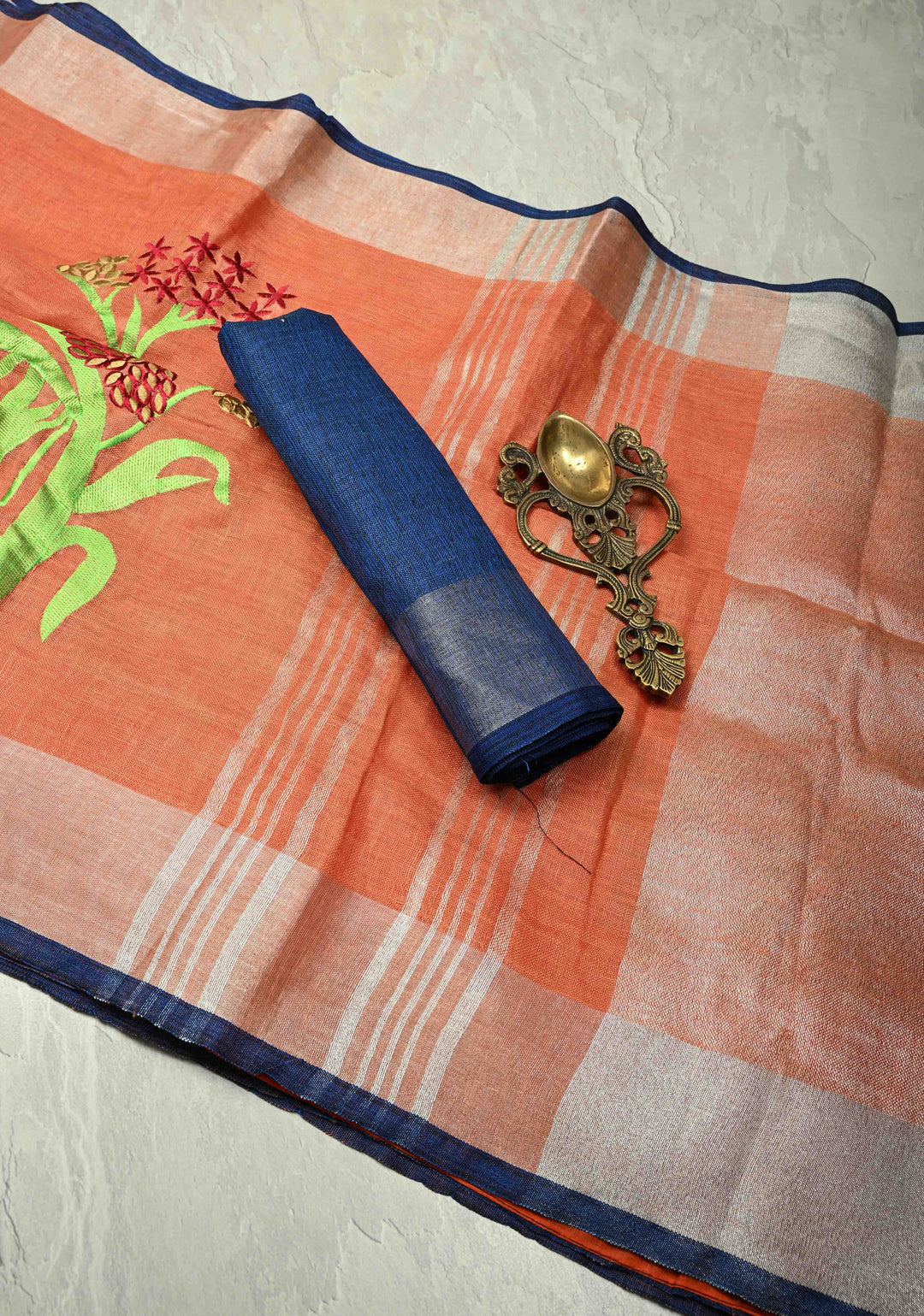 Dark Peach Linen Saree with Botanical Machine Embroidery and Tissue Zari Border