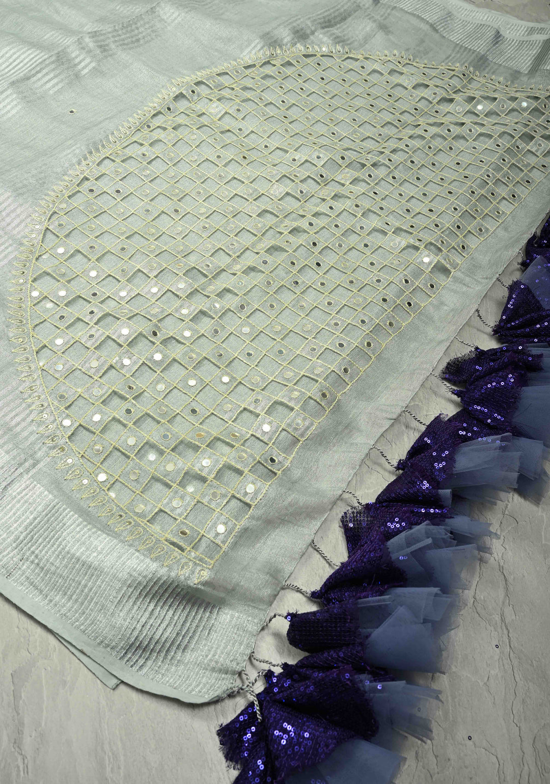 Cutwork and Mirror Work Tissue Linen Saree in Silver with Dramatic Fancy net Tassels