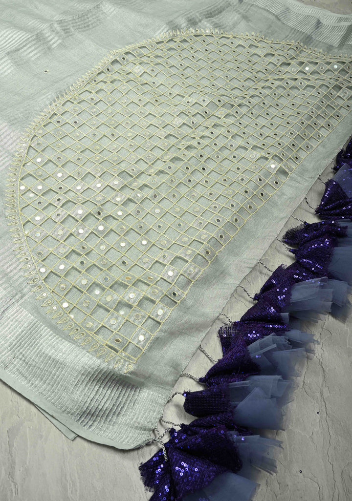 Cutwork and Mirror Work Tissue Linen Saree in Silver with Dramatic Fancy net Tassels