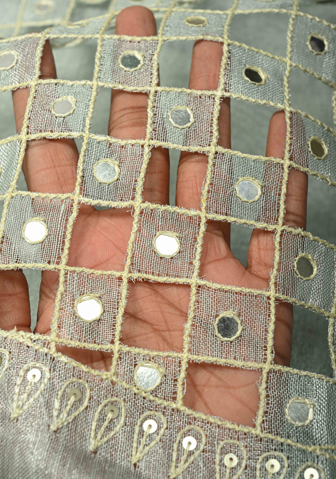 Cutwork and Mirror Work Tissue Linen Saree in Silver with Dramatic Fancy net Tassels