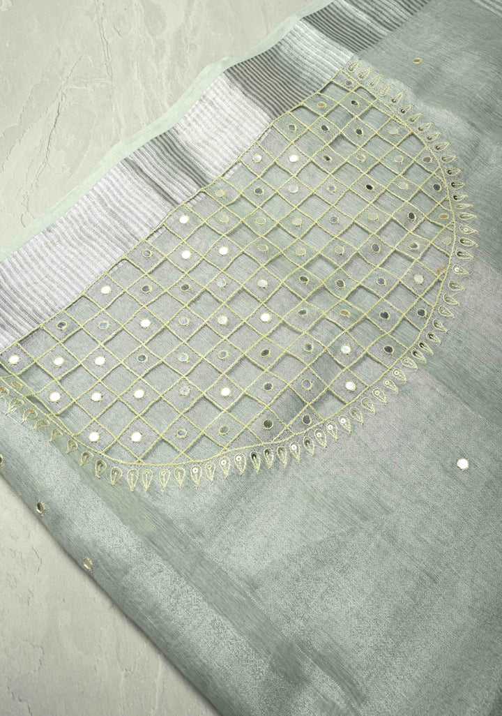 Cutwork and Mirror Work Tissue Linen Saree in Silver with Dramatic Fancy net Tassels