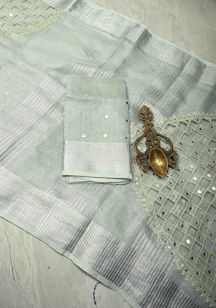 Cutwork and Mirror Work Tissue Linen Saree in Silver with Dramatic Fancy net Tassels