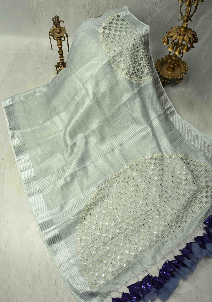 Cutwork and Mirror Work Tissue Linen Saree in Silver with Dramatic Fancy net Tassels