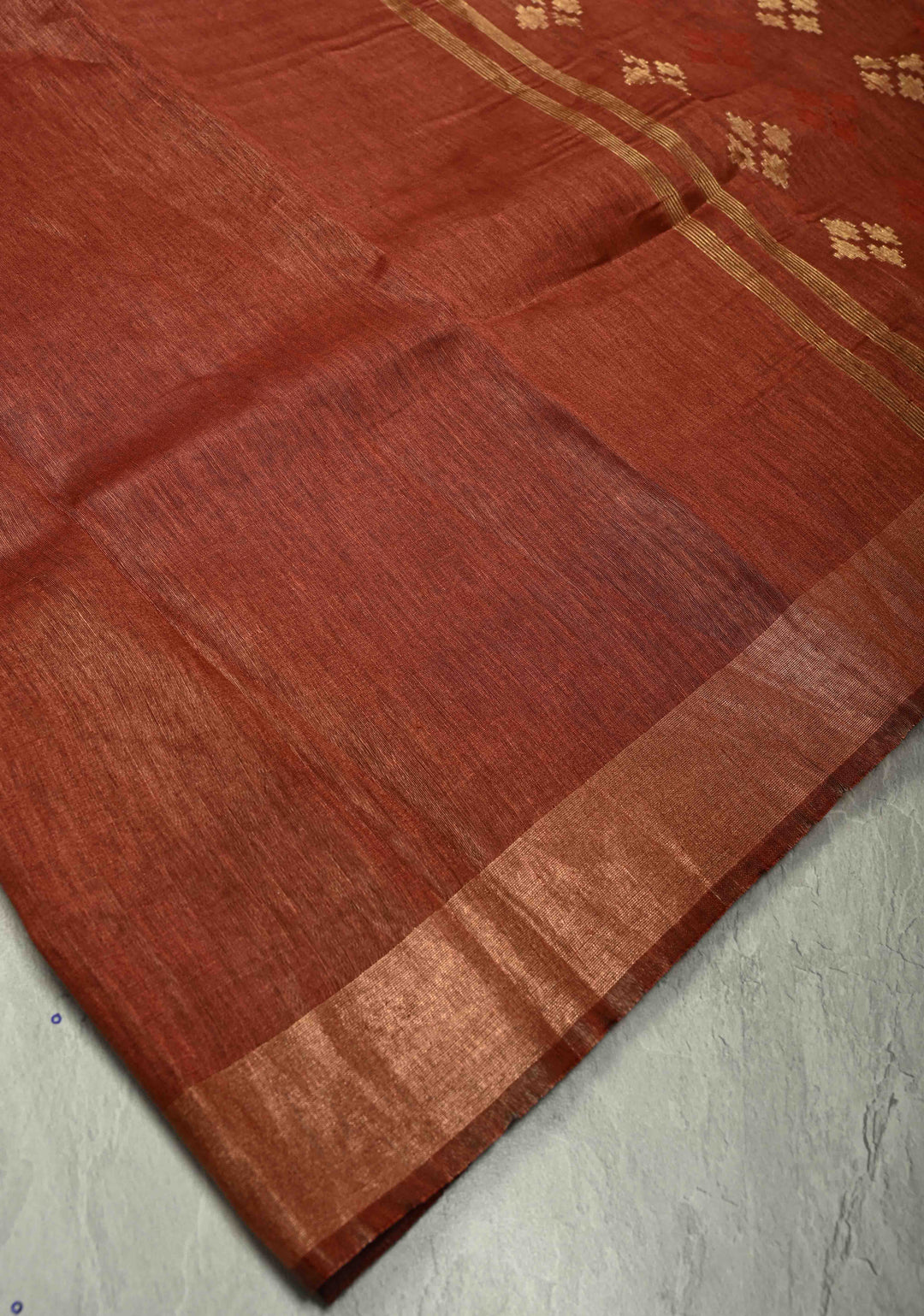 Copper Rust Silk Linen Saree with Muted Tissue Border and Floral Buttas on Pallu | SHOBITAM