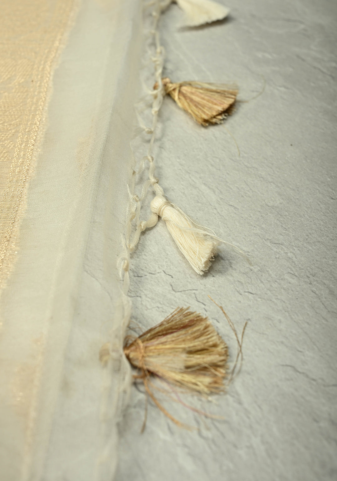 Ivory Banarasi Semi Kora Saree with Sona Rupa Buttas and Zari Border