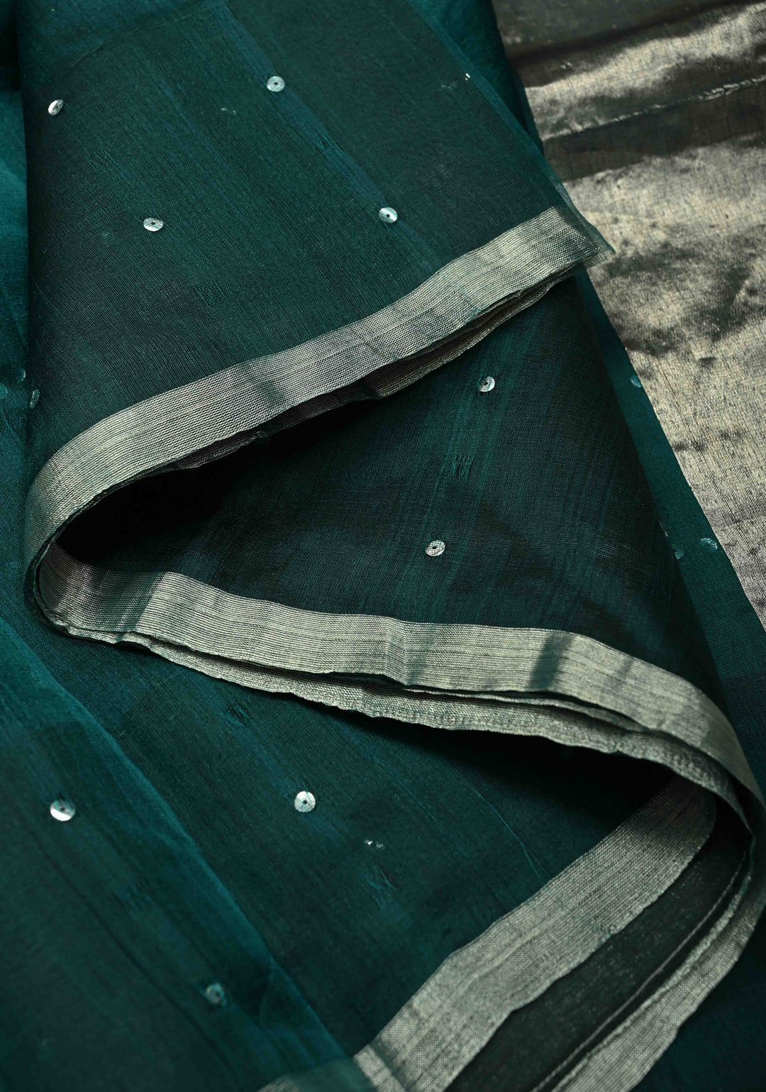 Pocket Sequins Woven on Pure Matka Muslin Saree in Dark Teal and Minimal Zari Border