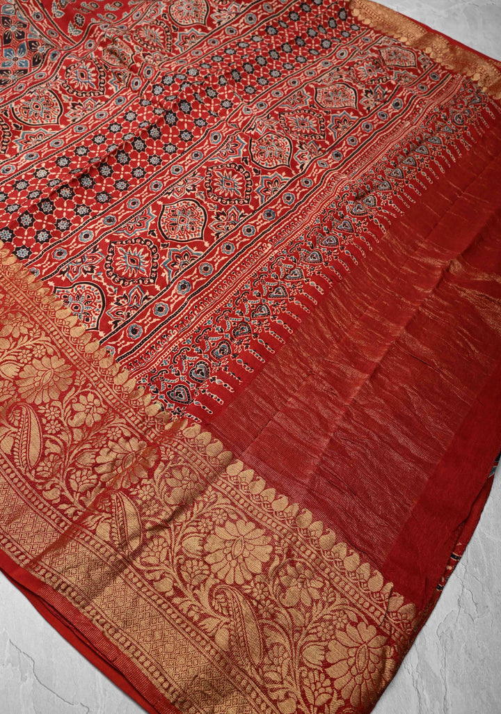 Ajrakh Hand Block Print on Modal Silk with woven Zari Borders and pallu in Red