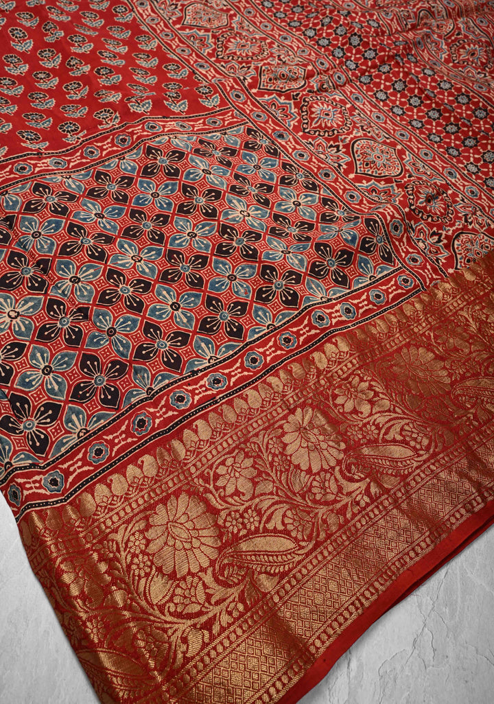 Ajrakh Hand Block Print on Modal Silk with woven Zari Borders and pallu in Red
