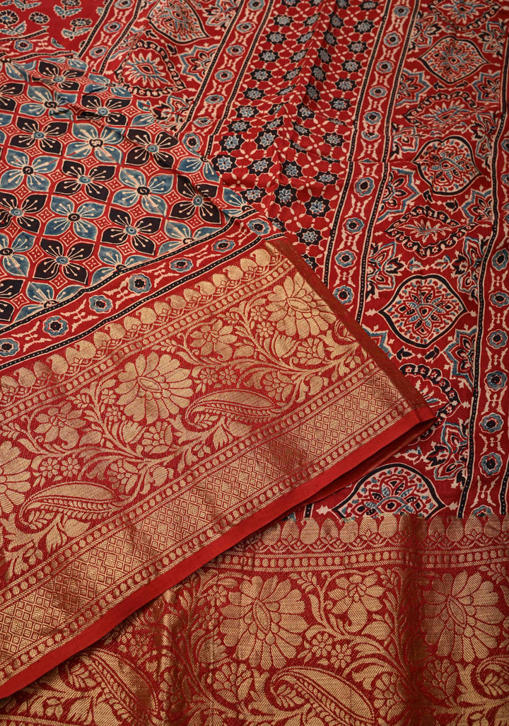 Ajrakh Hand Block Print on Modal Silk with woven Zari Borders and pallu in Red