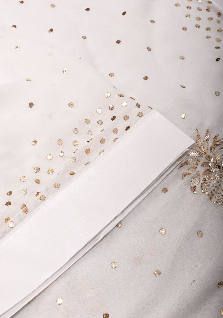 Exquisite and Authentic Hand Mukesh embellishments on White Pure Georgette Saree