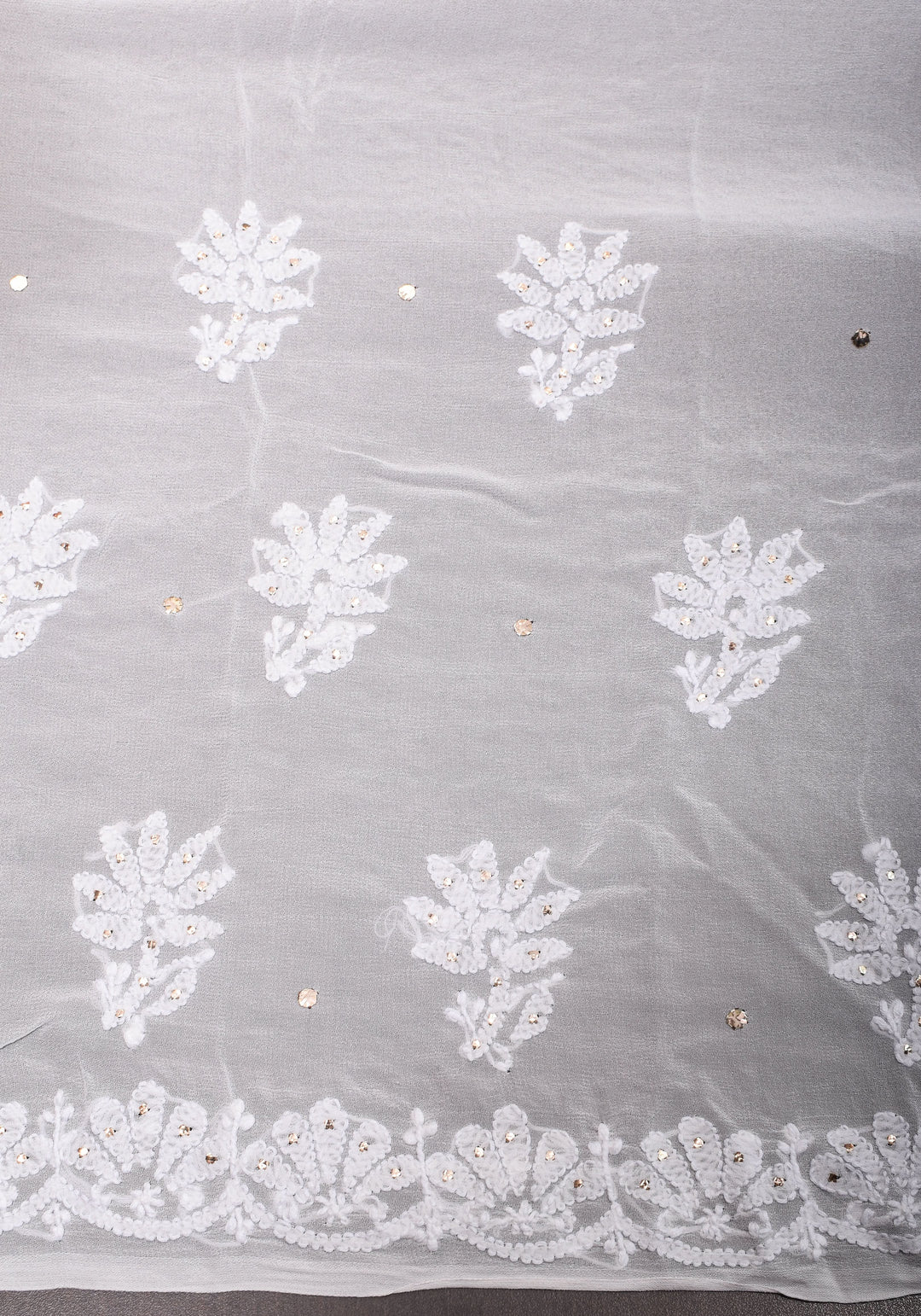Exquisite and Authentic Hand Mukesh embellishments on White  Pure Georgette Sareeg work