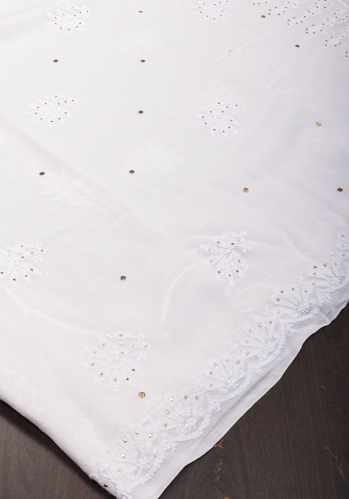 Exquisite and Authentic Hand Mukesh embellishments on White  Pure Georgette Sareeg work