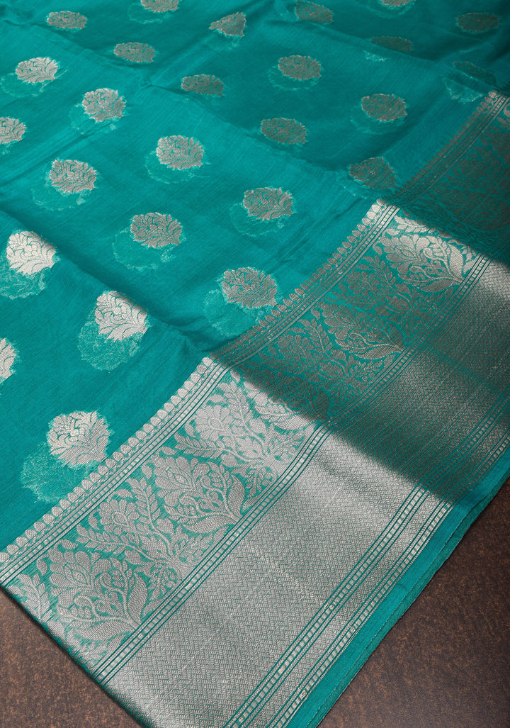 Unique Silver Zari butta Banarasi Semi Kora Silk Saree in Teal Blue with Silver tone zari
