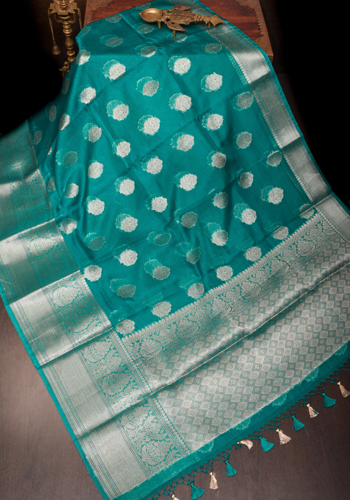 Unique Silver Zari butta Banarasi Semi Kora Silk Saree in Teal Blue with Silver tone zari