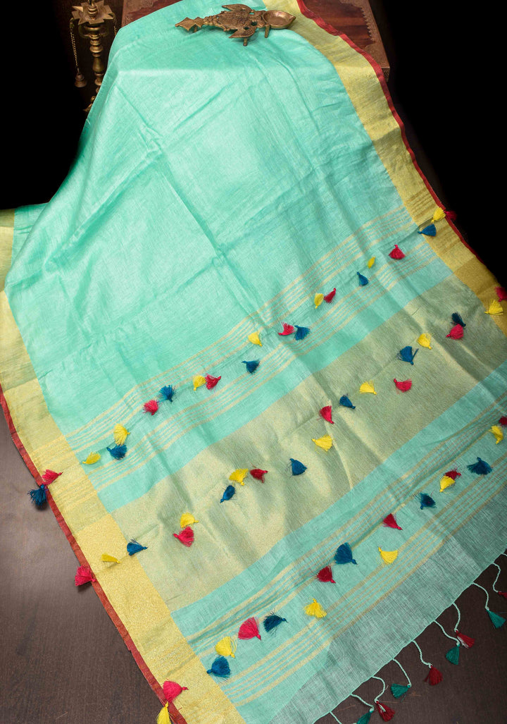 Seafoam Green Linen By  Linen Saree with Zari Border and Multicolor Tassels on Pallu
