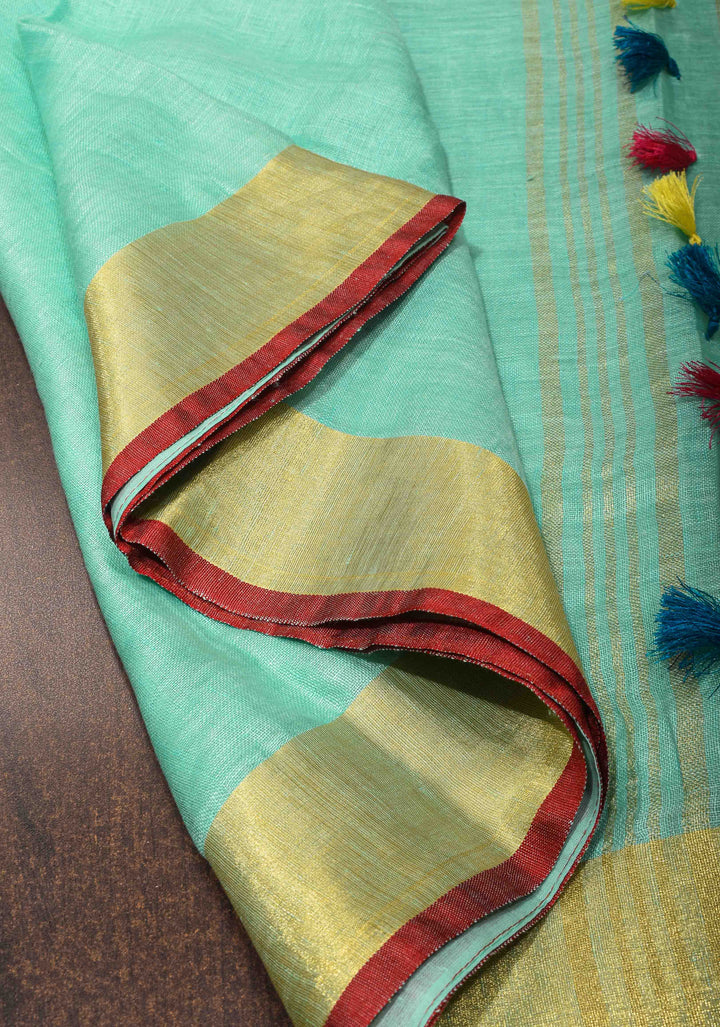 Seafoam Green Linen By  Linen Saree with Zari Border and Multicolor Tassels on Pallu