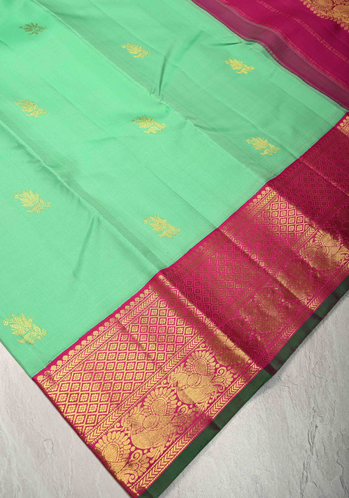 Meduim Spring Green Kanjivaram Pure Silk Saree with Floral Zari Buttas and Korvai Contrast Zari Border | SILK MARK CERTIFIED