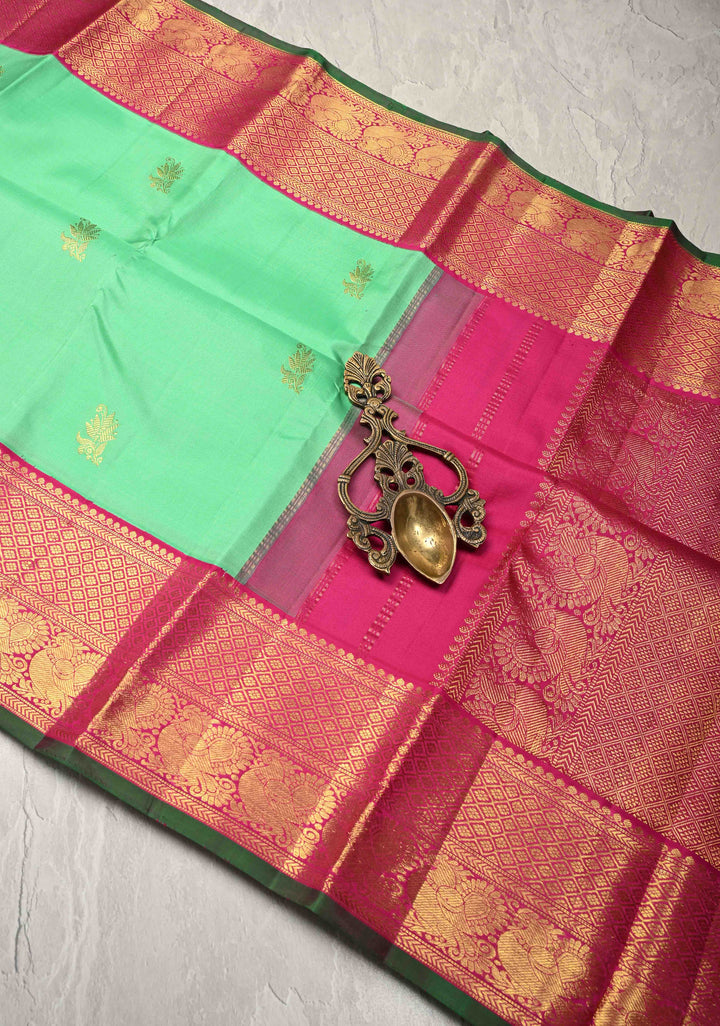 Meduim Spring Green Kanjivaram Pure Silk Saree with Floral Zari Buttas and Korvai Contrast Zari Border | SILK MARK CERTIFIED
