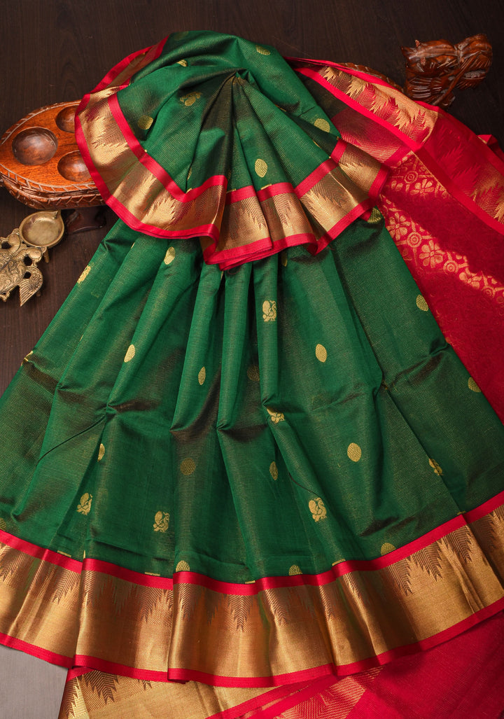 Kanchi Silk Cotton in Green and Red with Zari buttas and Temple Border
