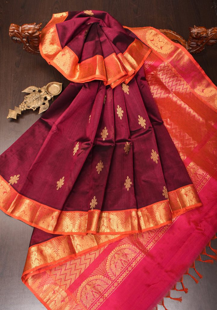 Kanchi Silk Cotton in Burgundy with Rangoli buttas and Zari border