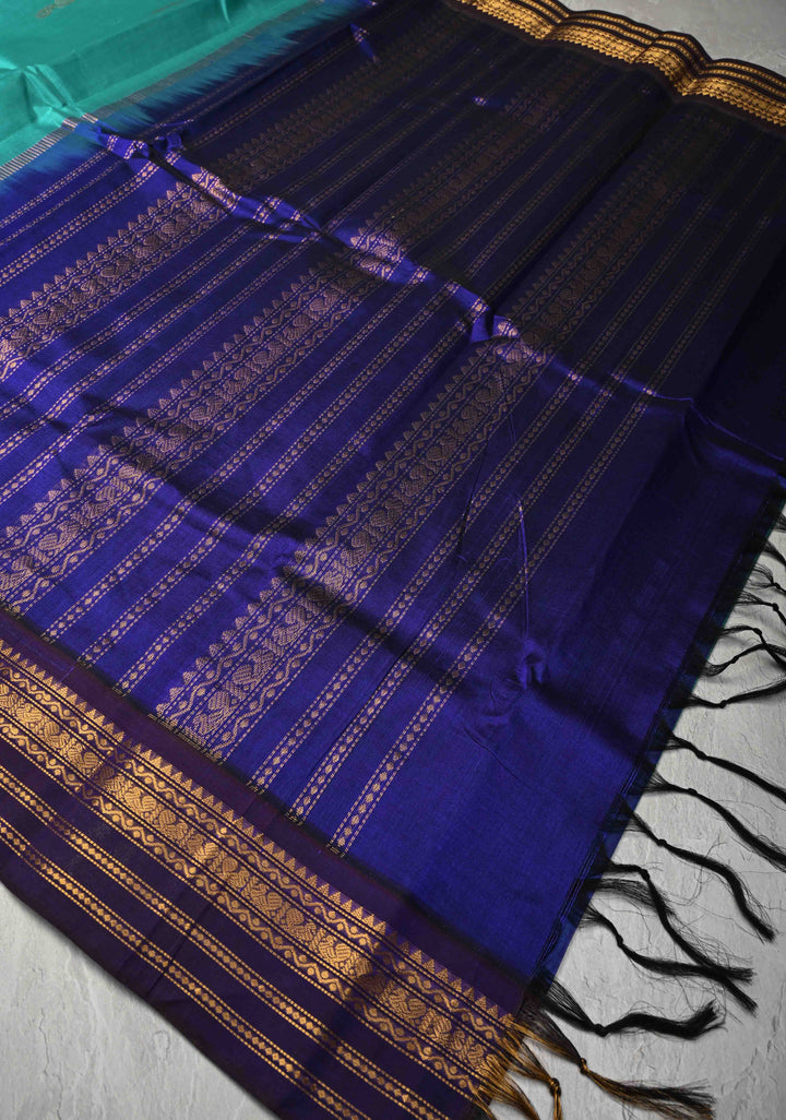 Sea Green Kanchi Silk Cotton Handloom Saree with Buttas and Koravi Contrast Zari Border