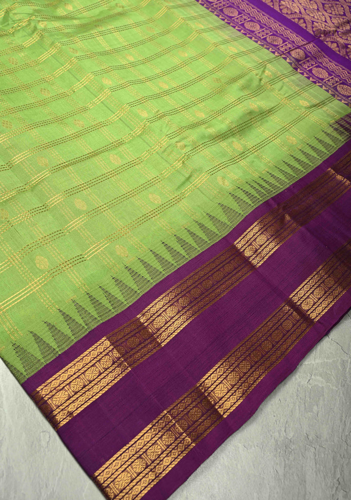 Pista Green Zari Checks on Kanchi Silk Cotton Saree with Zari Buttas and Contrast Rettaipet Border