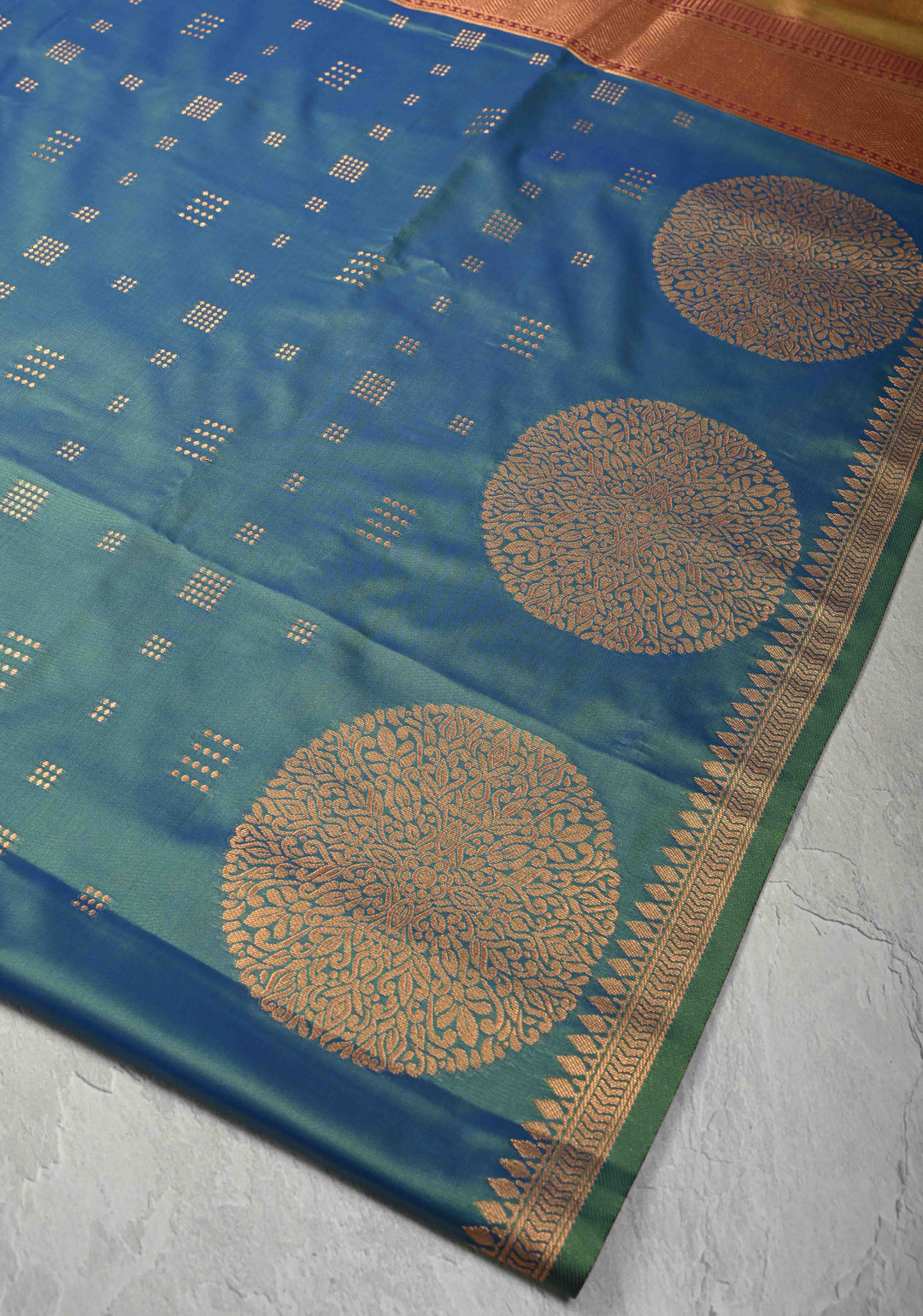 Peacock Blue Kanchi Semi Silk Saree with Zari Buttas and Mandala Motifs on Minimal Zari Border