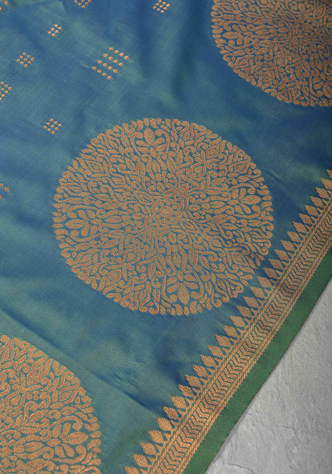 Peacock Blue Kanchi Semi Silk Saree with Zari Buttas and Mandala Motifs on Minimal Zari Border