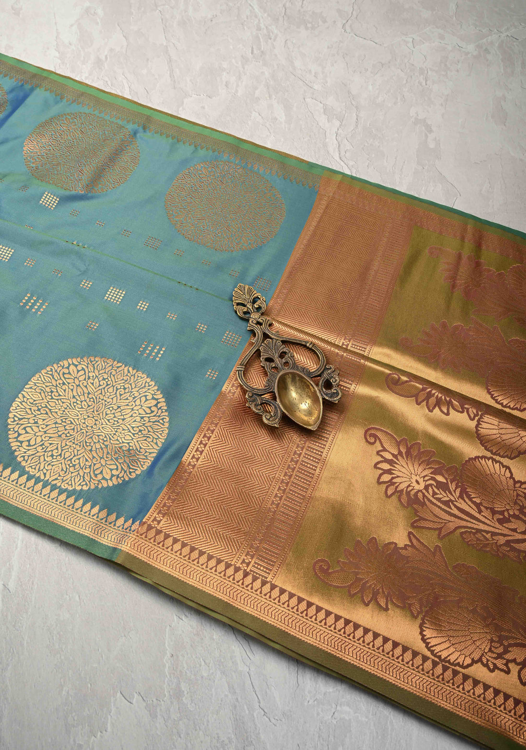 Peacock Blue Kanchi Semi Silk Saree with Zari Buttas and Mandala Motifs on Minimal Zari Border
