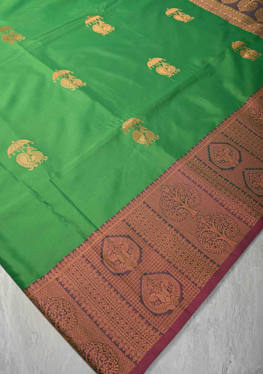 Green Kanchi Semi Silk Saree with Peacock Buttas and Contrast Zari Border