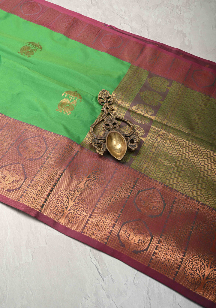 Green Kanchi Semi Silk Saree with Peacock Buttas and Contrast Zari Border