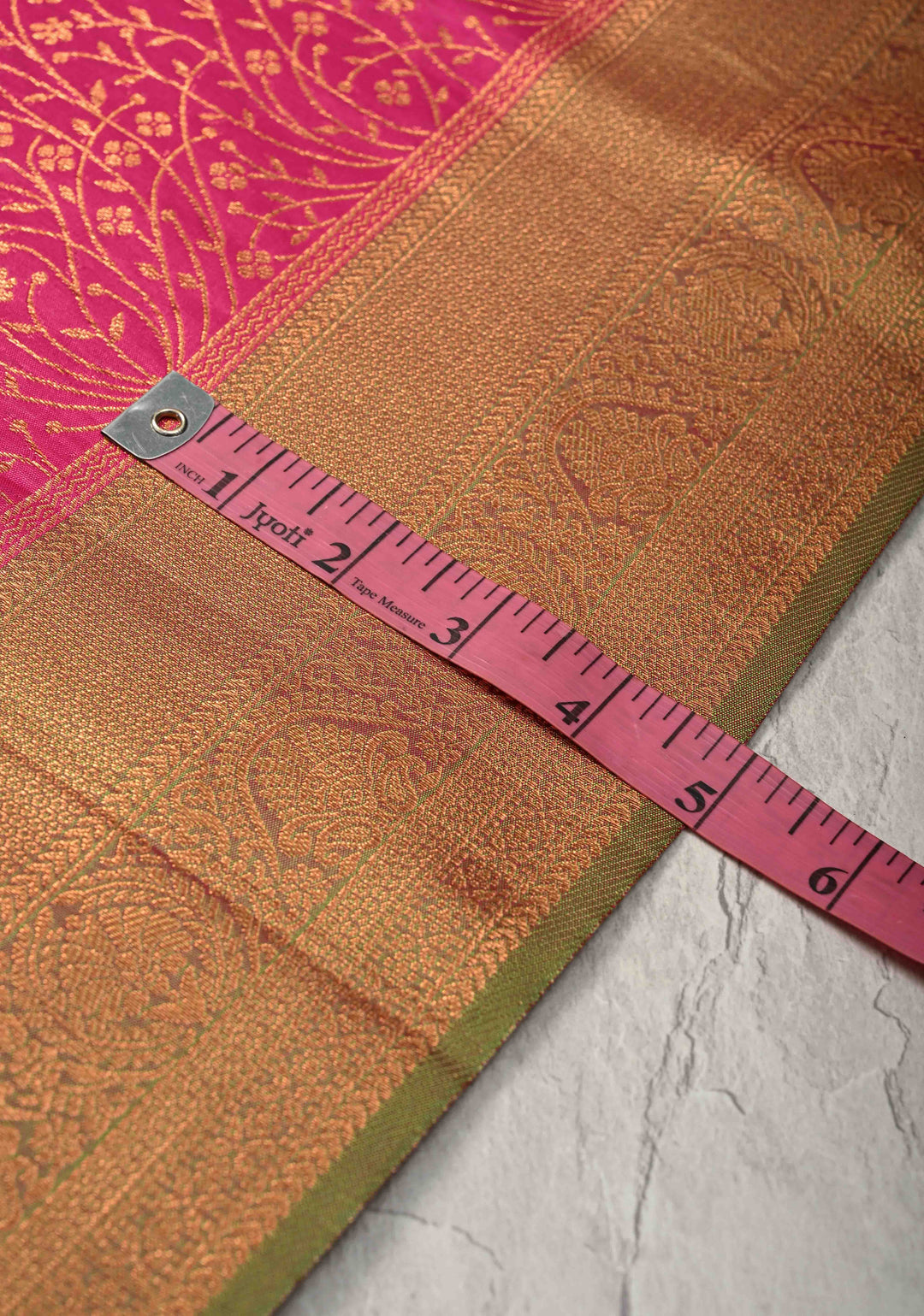 Fushsia Kanchi Semi Silk Saree with Floral Buttas and Zari Border