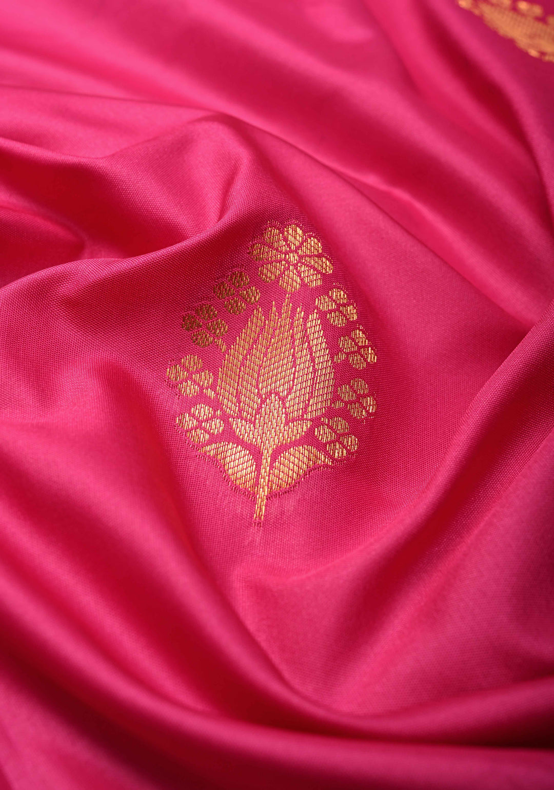 Fushsia Kanchi Semi Silk Saree with Floral Buttas and Zari Border