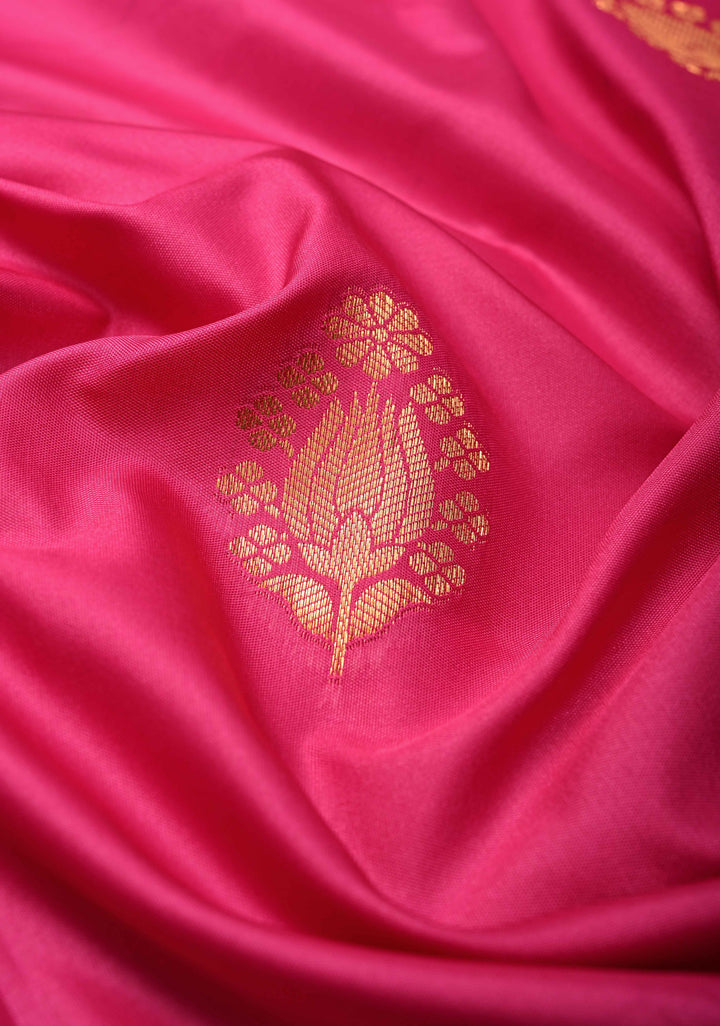 Fushsia Kanchi Semi Silk Saree with Floral Buttas and Zari Border