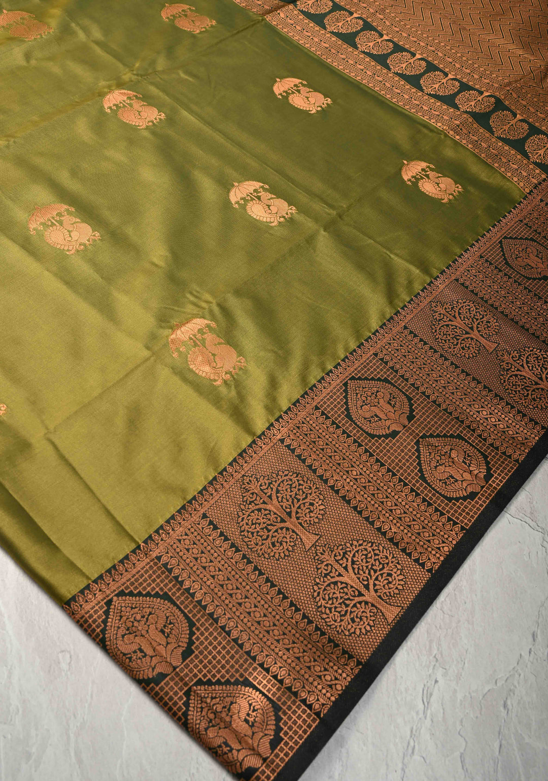 Henna Green Kanchi Semi Silk Saree with Peacock Buttas and Zari Border