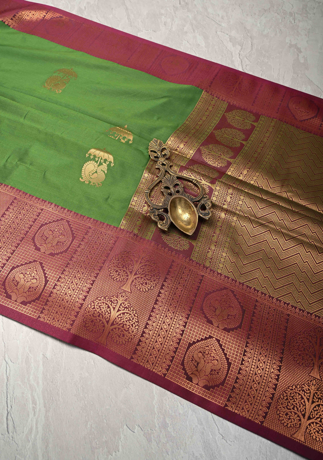 Sap Green Kanchi Semi Silk Saree with Peacock Buttas and Contrast Zari Border
