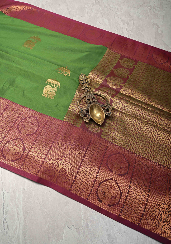 Sap Green Kanchi Semi Silk Saree with Peacock Buttas and Contrast Zari Border