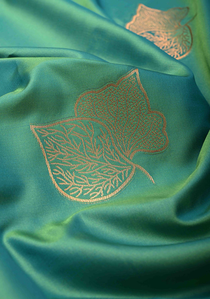Green Dual tone Kanchi Semi Silk Saree with Leaf Buttas and Contrast Zari Border