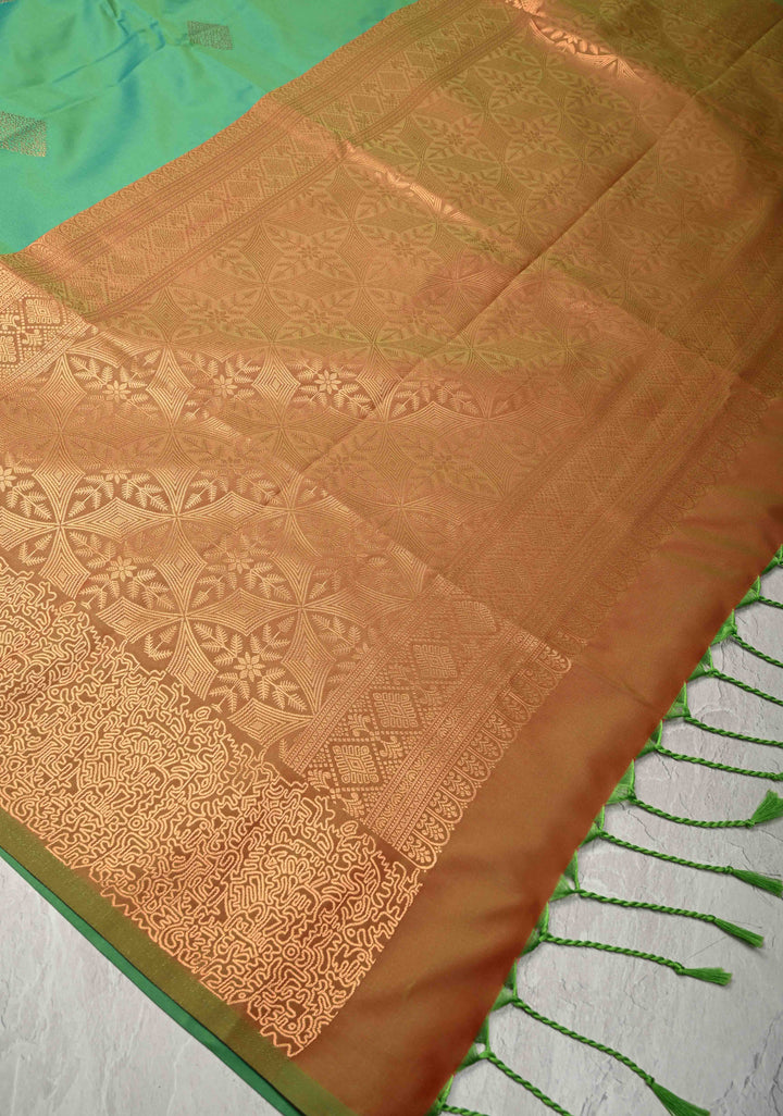 Green Kanchi Semi Silk Saree with Geometric Buttas and Abstract Zari Border