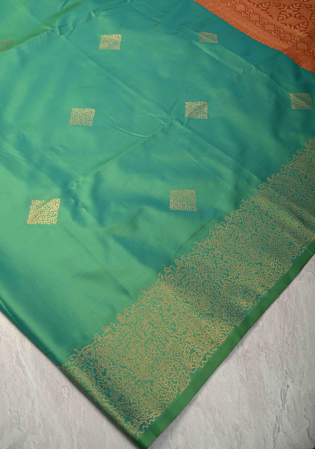 Green Kanchi Semi Silk Saree with Geometric Buttas and Abstract Zari Border