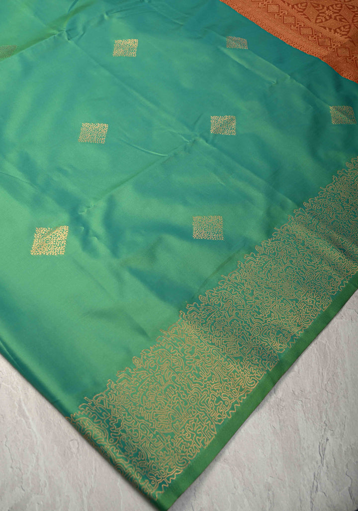 Green Kanchi Semi Silk Saree with Geometric Buttas and Abstract Zari Border