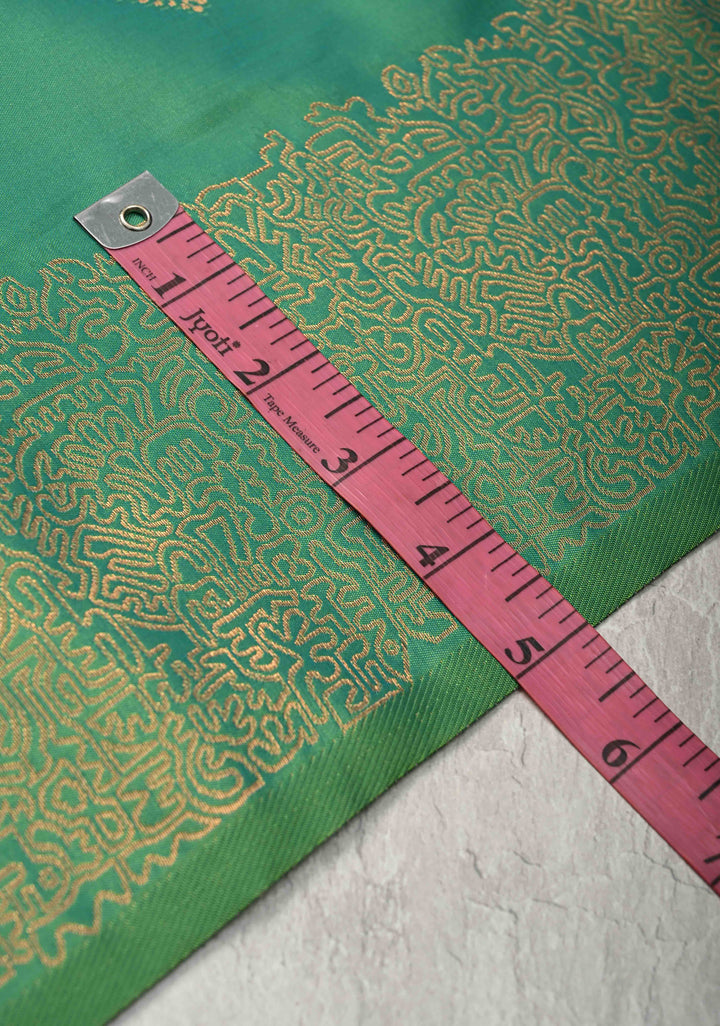 Green Kanchi Semi Silk Saree with Geometric Buttas and Abstract Zari Border