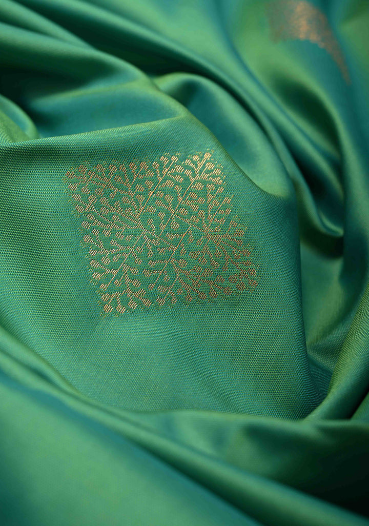 Green Kanchi Semi Silk Saree with Geometric Buttas and Abstract Zari Border