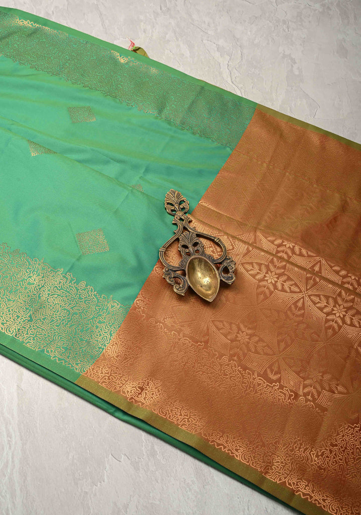 Green Kanchi Semi Silk Saree with Geometric Buttas and Abstract Zari Border