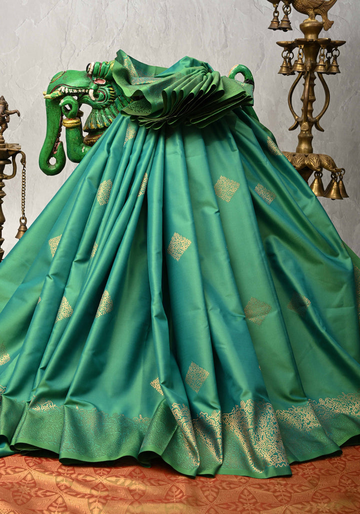 Green Kanchi Semi Silk Saree with Geometric Buttas and Abstract Zari Border